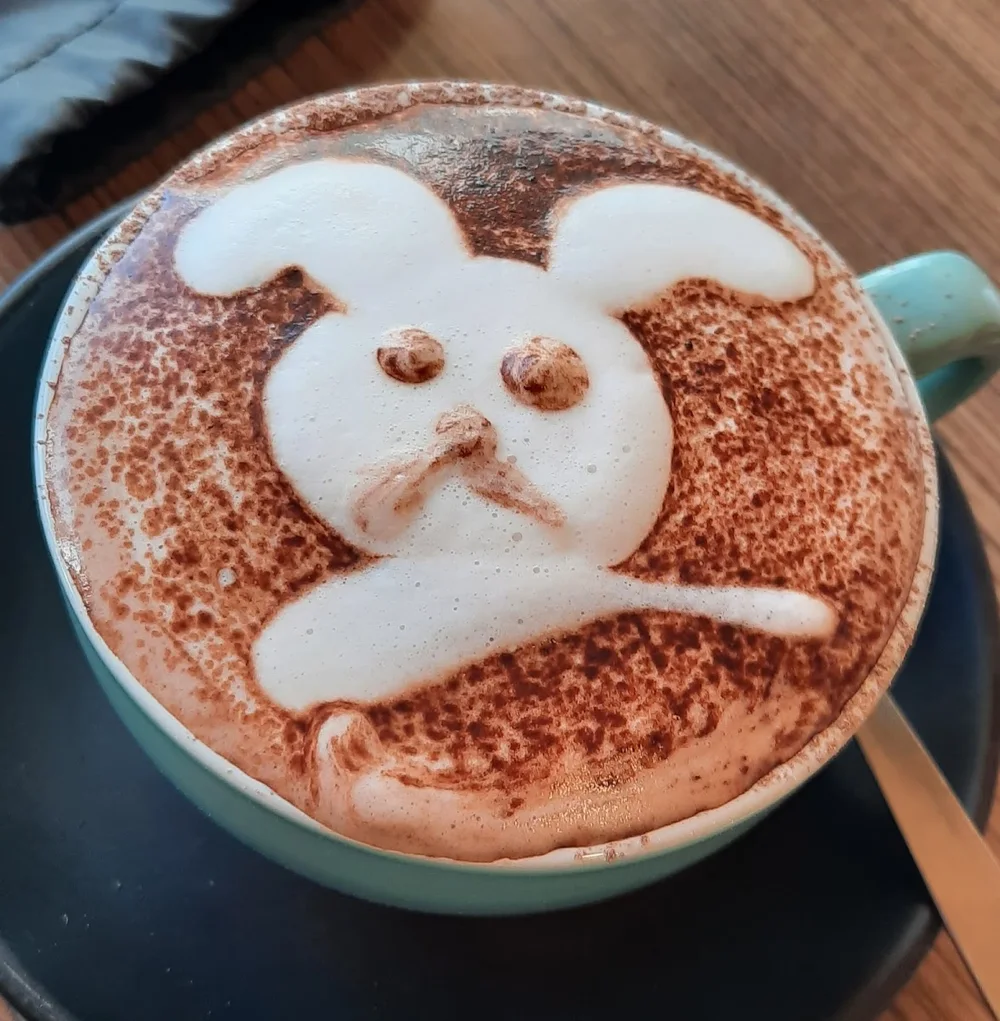 Hot chocolate with a playful bunny drawn in cocoa foam